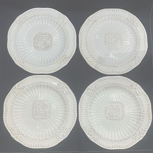 Set of four (4) luncheon plates in the Baroque pattern by American Atelier.